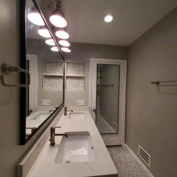 Bathroom remodeled With Double Sink, Standing Shower, Door Mirror & Flushing Toi