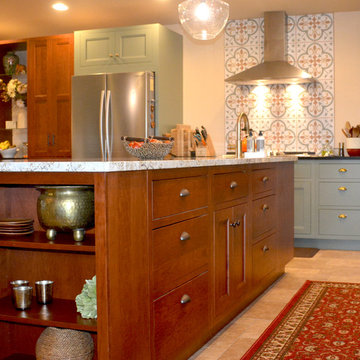 Cherry Island cabinetry with a paprka stain paired with the sage painted maple