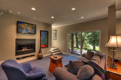 Basement - large walk-out carpeted basement idea in Cleveland with beige walls and a standard fireplace