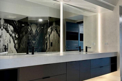 Inspiration for a large modern master black and white tile and stone slab porcelain tile, white floor and double-sink freestanding bathtub remodel in Miami with flat-panel cabinets, dark wood cabinets, an undermount sink, a hinged shower door, white countertops, a floating vanity and quartz countertops