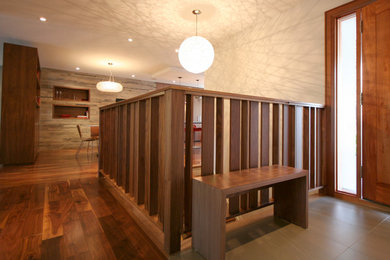 Trendy entryway photo in Toronto with a medium wood front door