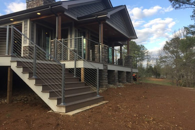 Example of a mid-sized arts and crafts backyard deck design in Other