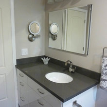 White cabinet with dark gray counter
