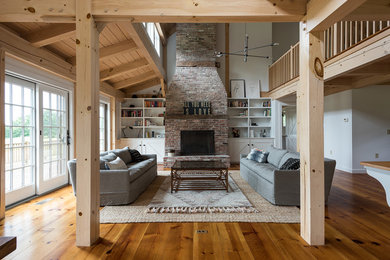 Living room - huge farmhouse open concept and formal medium tone wood floor and brown floor living room idea in New York with white walls, a standard fireplace, a brick fireplace and no tv