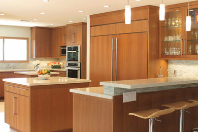 Huge mid-century modern open concept kitchen photo in Los Angeles with an undermount sink, flat-panel cabinets, medium tone wood cabinets, quartz countertops, multicolored backsplash, glass tile backsplash, stainless steel appliances and two islands