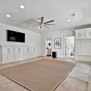Photo of a large classic walk-out basement in Other with white walls, porcelain flooring and blue floors.