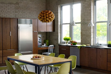 Inspiration for a large contemporary l-shaped porcelain tile eat-in kitchen remodel in Minneapolis with an undermount sink, flat-panel cabinets, dark wood cabinets, solid surface countertops, beige backsplash, brick backsplash, stainless steel appliances and an island