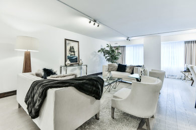 Living room - mid-sized contemporary formal and open concept light wood floor living room idea in Toronto with white walls, no fireplace and no tv