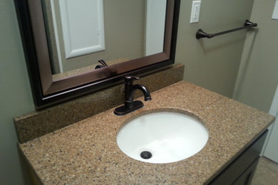 Bathroom - traditional bathroom idea in Other with an undermount sink, flat-panel cabinets, dark wood cabinets and quartzite countertops
