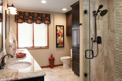 Large transitional master bathroom in Other with an undermount sink, raised-panel cabinets, dark wood cabinets, granite benchtops, an alcove shower, a two-piece toilet, beige tile, porcelain tile, beige walls, porcelain floors and beige floor.