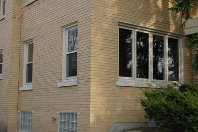 Inspiration for a large timeless brown brick exterior home remodel in Chicago