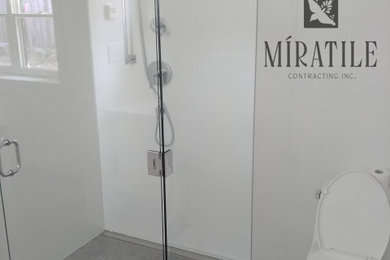 Walk-in shower - modern master white tile and porcelain tile porcelain tile and gray floor walk-in shower idea in Vancouver with a hinged shower door
