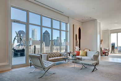 Example of a large trendy formal and open concept light wood floor living room design in Dallas with white walls, a standard fireplace, a stone fireplace and no tv