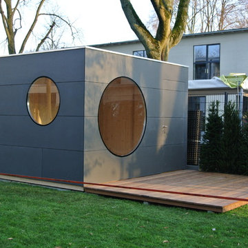 Gartenkubus mit Terrasse und Holzablagemöglichkeit