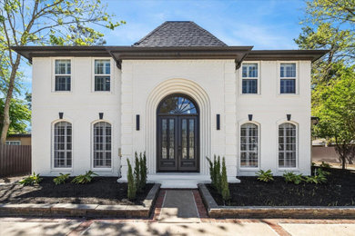 Inspiration for a huge modern white two-story brick house exterior remodel in Houston