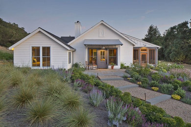 Example of a country white one-story exterior home design in San Francisco