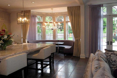 Inspiration for a contemporary slate floor kitchen remodel in Chicago with marble countertops and an island
