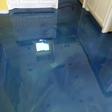 Pool house floor with blue metallic epoxy