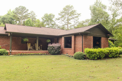 Example of a large transitional red one-story brick exterior home design in Atlanta with a shingle roof