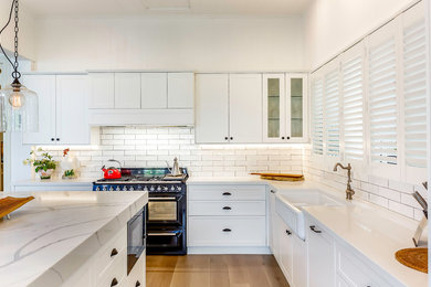 This is an example of a large traditional kitchen in Brisbane.