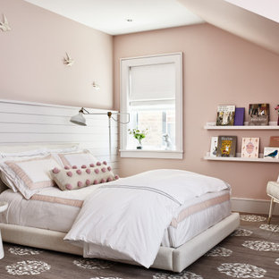 Inspiration for a large transitional girl medium tone wood floor and brown floor kids' room remodel in Los Angeles with pink walls