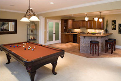 Example of a mid-sized underground carpeted basement design in Charleston with beige walls
