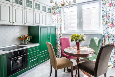 Photo of a small eclectic single-wall kitchen in Other with green cabinets, laminate benchtops, white splashback, ceramic splashback, laminate floors and no island.