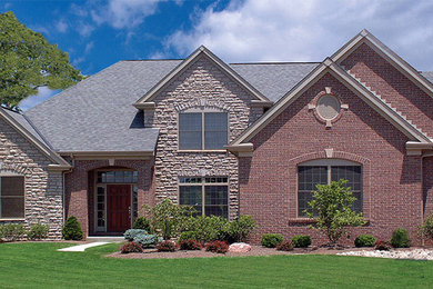 Large transitional two-story brick exterior home photo in Cincinnati
