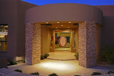 Mid-sized southwest beige two-story stucco exterior home photo in Phoenix