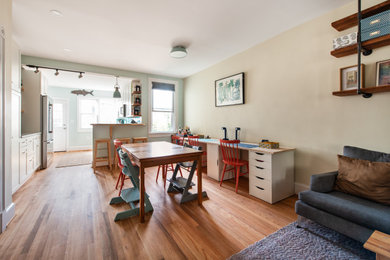Kitchen/dining room combo - mid-sized eclectic light wood floor kitchen/dining room combo idea in DC Metro with beige walls
