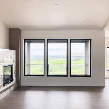 Black windows with sheetrock finish overlooking deck