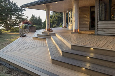 Large minimalist backyard deck photo in Other