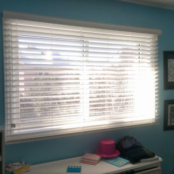 Faux wood blinds in a bedrrom