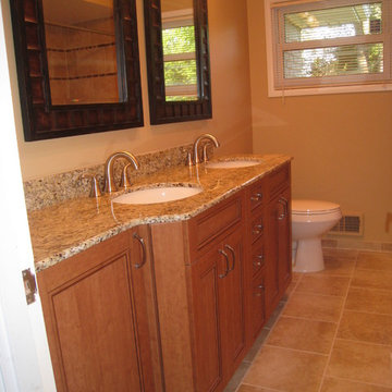 Rustic Cherry Vanity Cabinets with Venetian Gold Granite Countertops