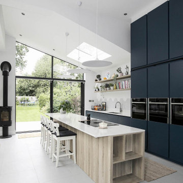 Matt blue and oak handleless kitchen