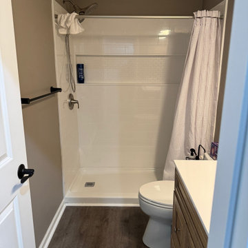 Transitional Basement With Under-Stair Wet Bar