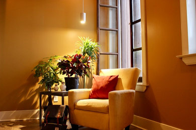 Small cottage chic loft-style light wood floor living room library photo in Philadelphia with beige walls and a wall-mounted tv