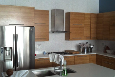 Example of a large minimalist kitchen design in Chicago with beige backsplash and porcelain backsplash