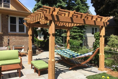 Example of an arts and crafts patio design in Chicago