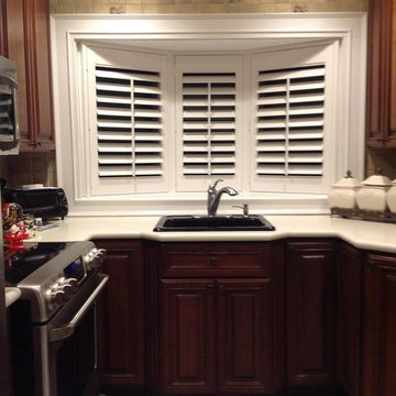 White Shutters in a Bay Window