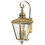 Livex Lighting Lights - Cambridge Outdoor Wall Lantern, Antique Brass - This stylish antique brass outdoor wall lantern is a great way to update your home's exterior decor. A flat metal curved arm attaches the solid brass decorative housing to the square backplate while clear water glass protects the three bulbs.