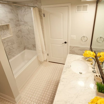 Elegant Bathroom with Marble Vanity and Tub-Shower Combo