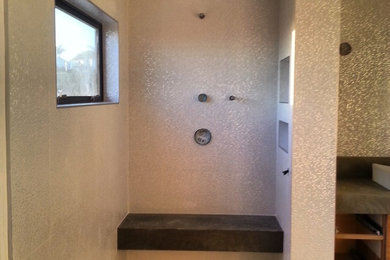 Inspiration for a large contemporary master white tile and ceramic tile porcelain tile bathroom remodel in Orange County with a drop-in sink, flat-panel cabinets, medium tone wood cabinets, concrete countertops, a one-piece toilet and white walls