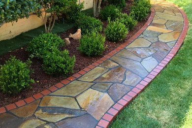Inspiration for a brick landscaping in Austin.
