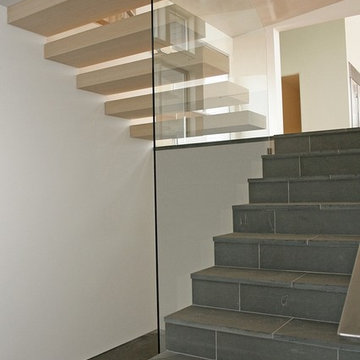 Stone, Floating Stairs, & Glass Rail