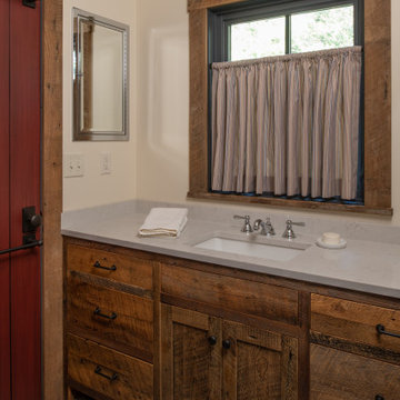 Reclaimed Wood Vanity and Trim in Rustic Cabin Bathroom