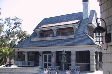 Inspiration for a large timeless two-story wood exterior home remodel in Charleston