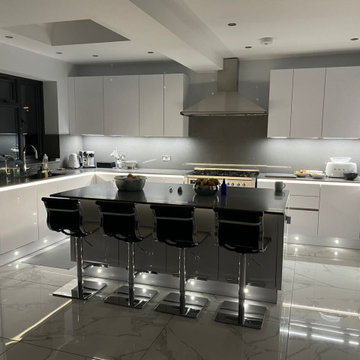 Hacker German made kitchen in white gloss handleless with channel