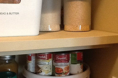 Kitchen pantry - mid-sized contemporary u-shaped kitchen pantry idea in Other with raised-panel cabinets, light wood cabinets, laminate countertops and an island