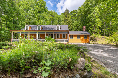 Large traditional orange three-story wood house exterior idea